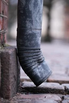 Rain gutter downpipe Stock Photos