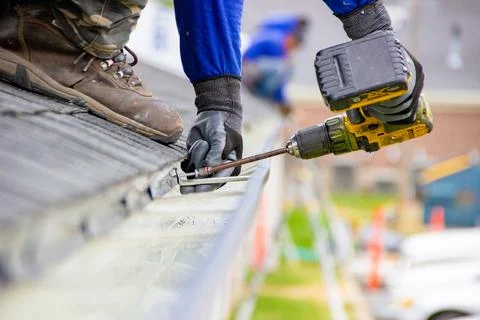 Rain gutter installation Stock Photos