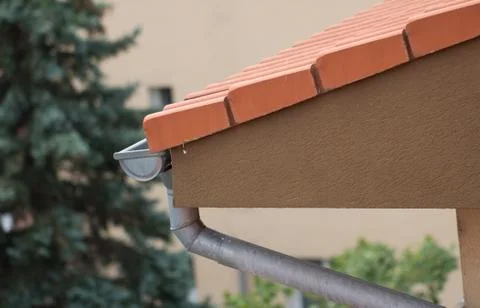 Rain gutter on roof Stock Photos