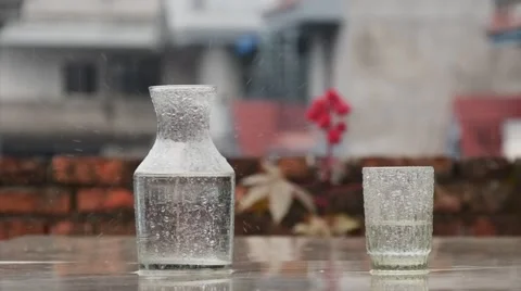 Rain hit the table in slow motion Stock Footage 62227539