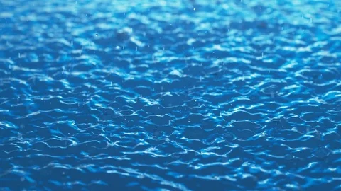 Rain Hits Blue Water Surface In Slow Motion Stock Footage 84183896