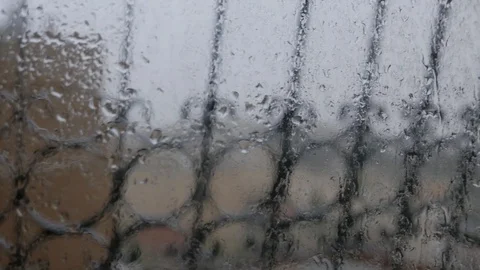 Rain Hits The Glass, The Defocused Window Grilles In The Background Stock Footage 88967294