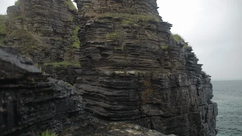 Rain hitting the Cliff face rocks Stock Footage 111568215