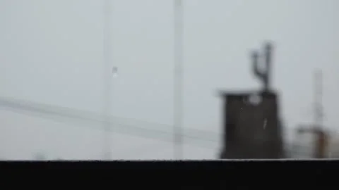 Rain Hitting Handrail With Chimneys as Background 2 Stock Footage 241021116