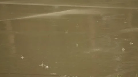 Rain hitting pavement Stock Footage 277987561