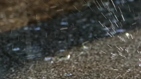 Rain Hitting Sidewalk Tiles with Sunlit Splashes and Reflections Stock Footage 321924905