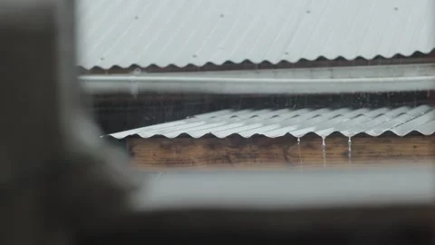 Rain hitting tin roofs in winter Stock Footage 233381829
