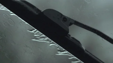 Rain hitting wind shield in slow motion w/windshield wipers Stock Footage 47453305