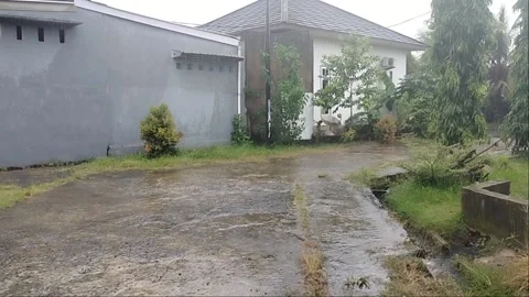 Rain on the house in the afternoon Stock Footage 235701585