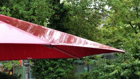 Rain knocks on the red painted metal roof 스톡 동영상 104672650