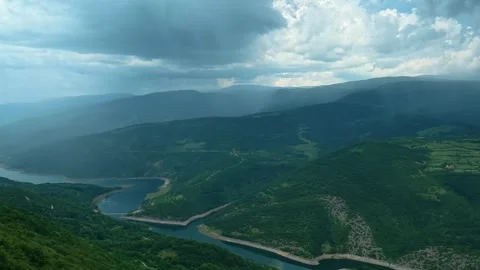 Rain lashes across rolling green hills. Kozji Kamen viewpoint, Serbia 스톡 동영상 341875347