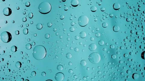 Rain Macro Droplets On Glass Surface Turquoise Color Background Stock Photos
