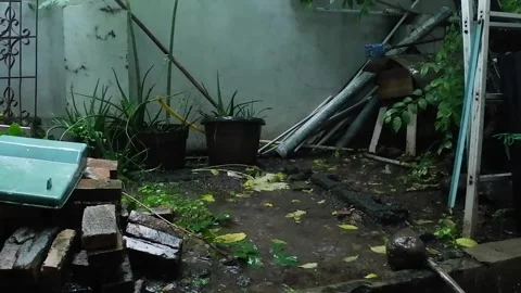Rain in messy backyard still frame establish background footage Video stock 278727101