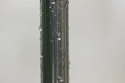 Rain on metal pipe Stock Photos