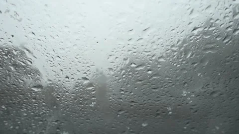 Rain mixed with snow on car windshield in a gloomy day Stock Footage 150539012