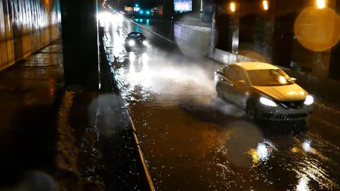 Rain at night with car passing Stock Footage 125552782