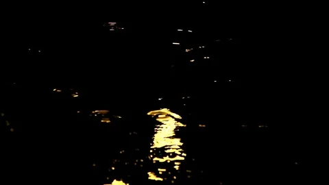 Rain at night drips through the puddles. circles on the water from the drops Stock Footage 112222189