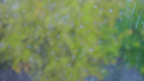 Rain outside and rain drops on window glass. Slow motion. Changing focus on drop Stock Footage 139618252