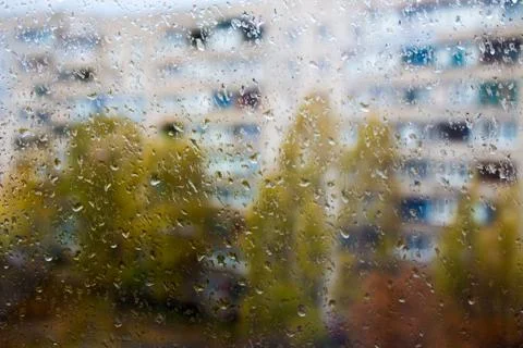 Rain outside the window, drops of rain on the windowpane Stock Photos