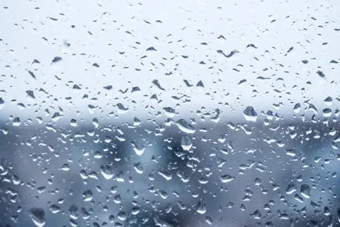 Rain outside the window, drops of rain on the windowpane Photos