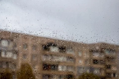 Rain outside the window, drops of rain on the windowpane Stock Photos