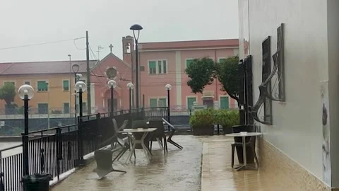 Rain Outside the Window with Falling Drops, Cafe Tables Get Wet.  Stock Footage 246382751