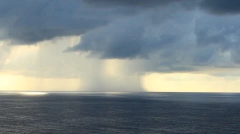 Rain over the sea and light passing through clouds Stock Footage 50815588