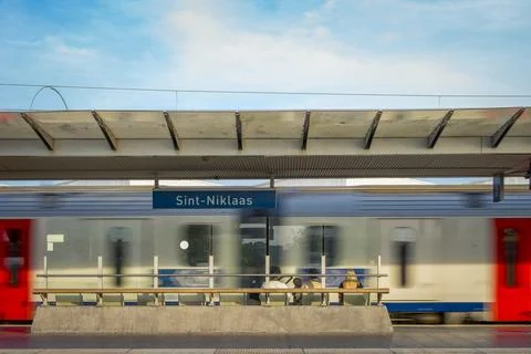 Rain passing by on the train station platform of Sint Niklaas railway stati.. Stock Photos