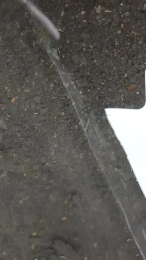 Rain Patterns Forming In A Small Puddle Stock Footage 327176630