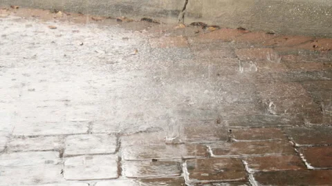 Rain Pelts Cobblestone Pavement Stock Footage 284269534