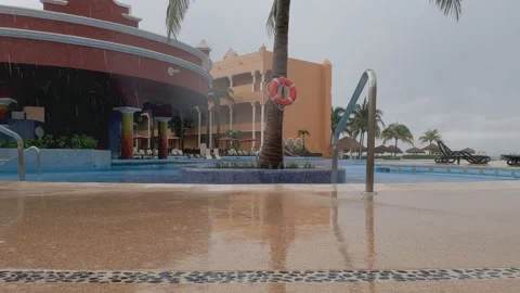 Rain by the pool in Cancun Stock Footage 218231384