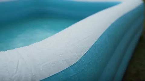 Rain in pool Stock Footage 136917757