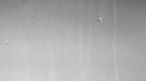 Rain pounding against the window on white background Stock Footage 52660030