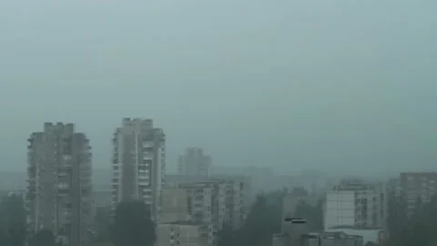 Rain pounding on window glass during hard rainstorm, heavy rain in the city Stock-Footage 157498274