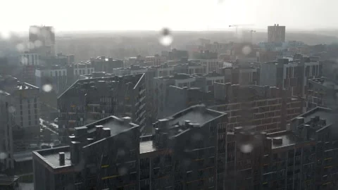 Rain pouring down on a modern cityscape with contemporary architecture Stock Footage 339626164