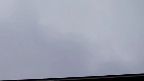 Rain is Pouring Through the Window in a Stream With Gusts of Wind.  Stock Footage 236288351
