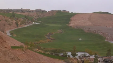 Rain pours down on desert golf course A Stock Footage 125344721