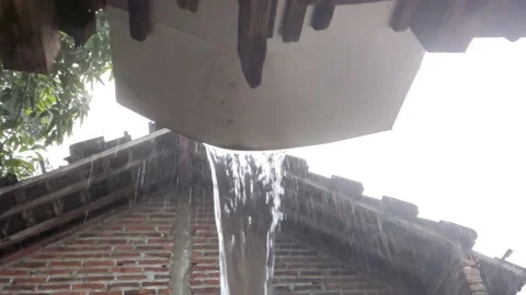 The rain pours down the gutters Stock Footage 219735441
