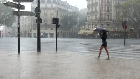 Rain pours down over Place Victor-et-Hélène-Basch in Paris Stock Footage 166540259