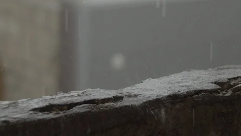 Rain, raindrops fall on the concrete floor in slow motion Stock Footage 113282042