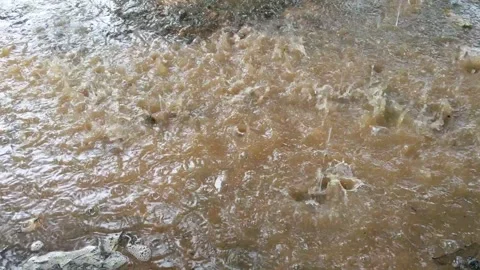 Rain on red soil and causing water to stagnate Stock Footage 321751217