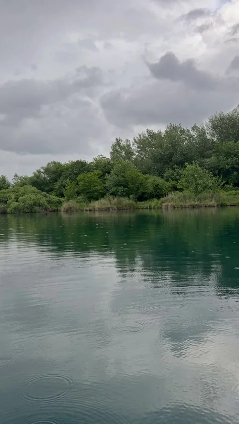Rain ripples on Lago dell Accesa in Tuscany Stock Footage 334803359