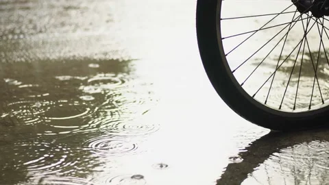 Rain on the road, bicycle wheel. Stock Footage 169879524