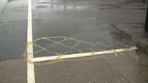 Rain on the road with yellow marking and white lines Stock Footage 7139215