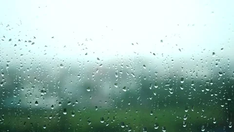Rain running down on window surface. rain drop in rainy day Video stock 311046620