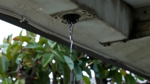 Rain running out of dirty rain gutter. Stock Footage 121223929