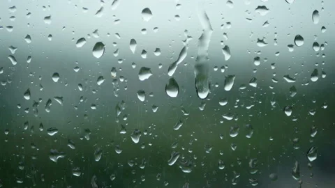 Rain running up on window surface. rain drop in rainy day Stock Footage 135792675