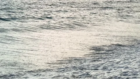 Rain at sea. Dark storm clouds, rain, and sea surface at sunset. Waves crashing Stock Footage 310302260