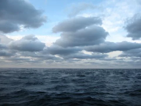 Rain in the sea. Stock Photos