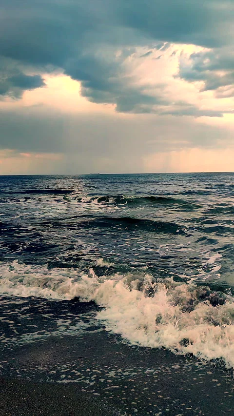 Rain on the sea. Rain streams and flows sea surface in cloudy weather Vertical Stock Footage 284466110